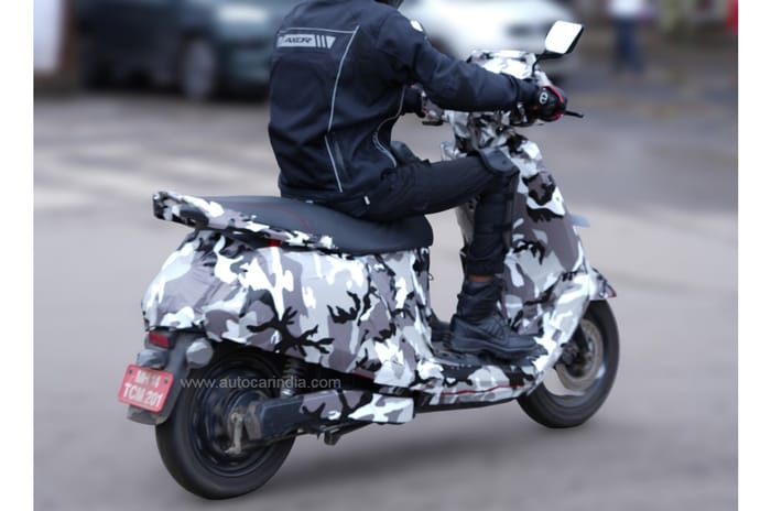 Kinetic Green electric scooter rear right angle riding shot